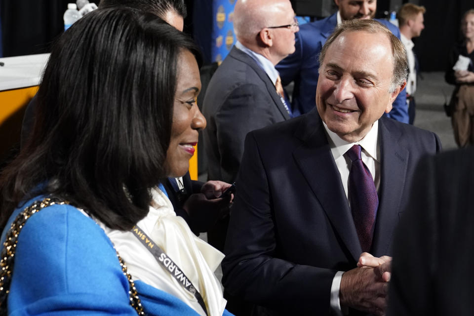 Tennessee State University president Glenda Glovers, left, talks with NHL commissioner Gary Bettman, right, before a news conference, Wednesday, June 28, 2023, in Nashville, Tenn. The school plans become the first historically Black college and university to introduce ice hockey. The program has been created in partnership with the National Hockey League, National Hockey League Players' Association and the Nashville Predators. (AP Photo/George Walker IV)