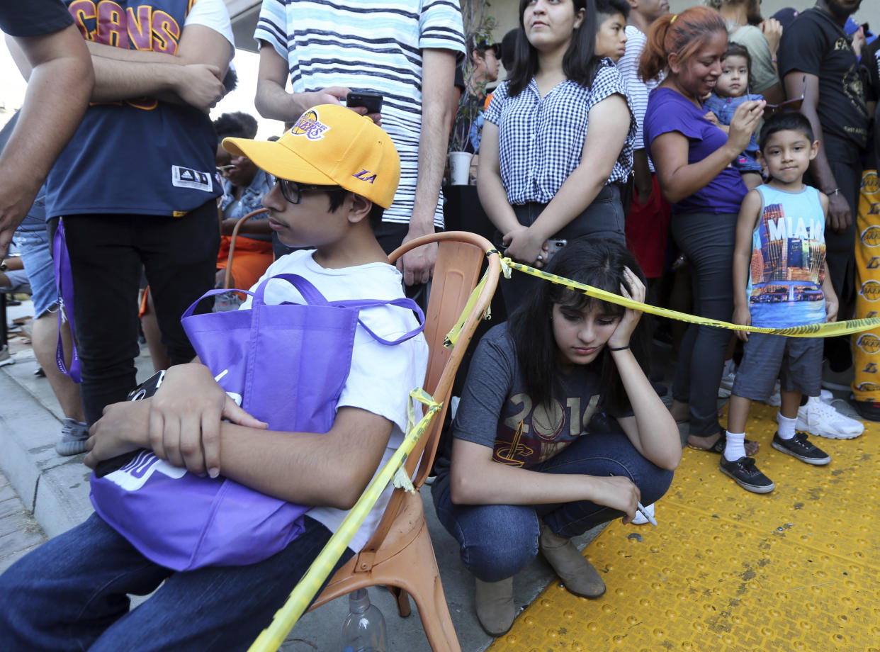 Dejected fans await LeBron James’ arrival at Blaze Pizza in Culver City, California. (AP)