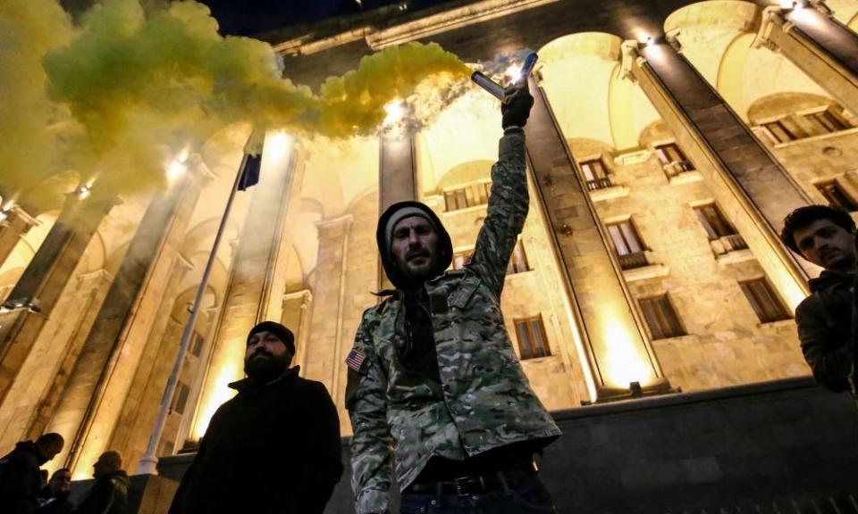 Protesters with flares demonstrate against the ‘foreign agents’ law in Tbilisi last week.