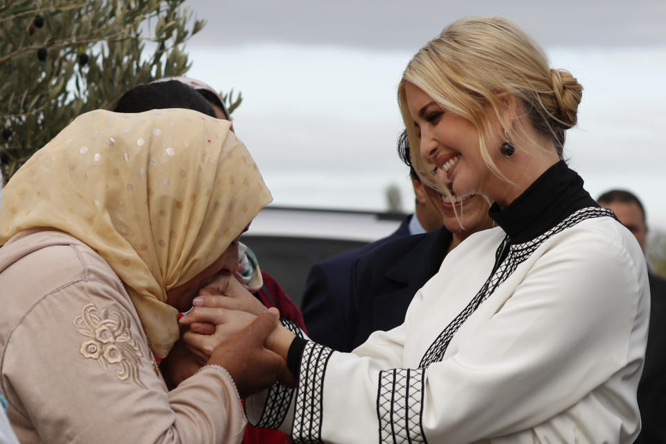 Farmer Aicha Bourkib kisses Ivanka Trump's hand, the daughter and senior adviser to President Donald Trump, in the province of Sidi Kacem, Morocco, Thursday, Nov. 7, 2019, as Ivanka Trump tours an olive grove collective where local women farmers are benefitting from changes allowing them to inherit land. (AP Photo/Jacquelyn Martin)