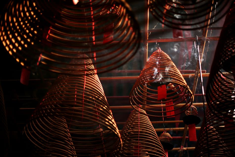 Incense is seen burning inside the Man Mo Temple in Hong Kong. Built by Chinese merchants for the worship of Mo Tai (God of Martial Arts) and Man Cheong (God of Literature) between approximately 1847 and 1862, the Man Mo Temple Compound takes up three blocks consisting of Man Mo Temple, Lit Shing Kung and Kung Sor.