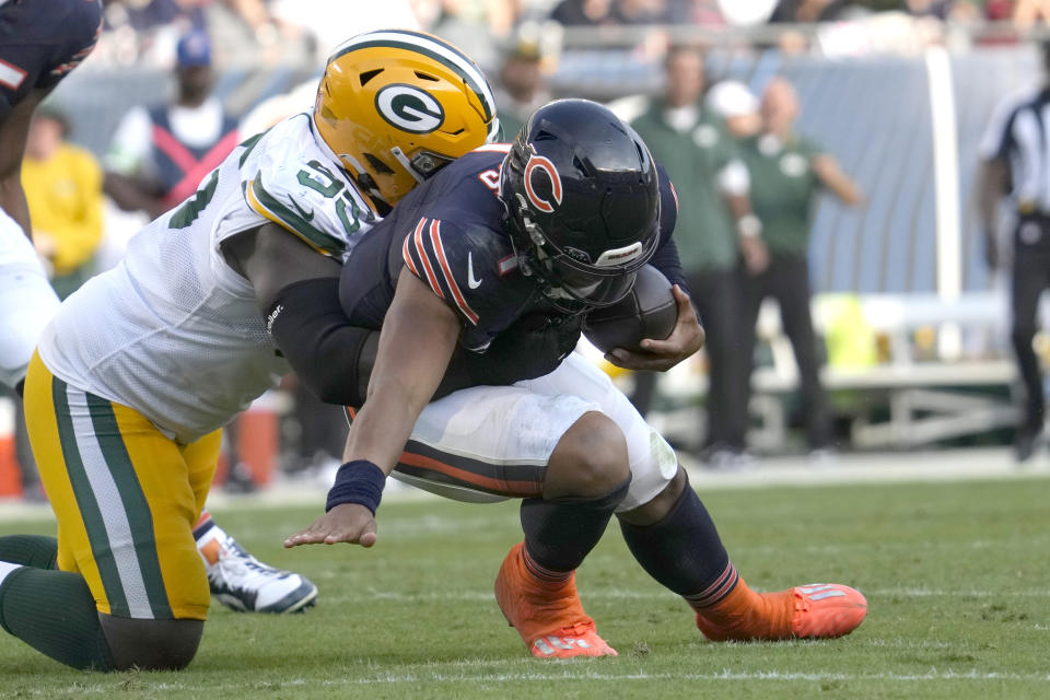 Green Bay Packers defensive tackle Devonte Wyatt sacks Chicago Bears quarterback Justin Fields during the second half of an NFL football game Sunday, Sept. 10, 2023, in Chicago. (AP Photo/Nam Y. Huh)