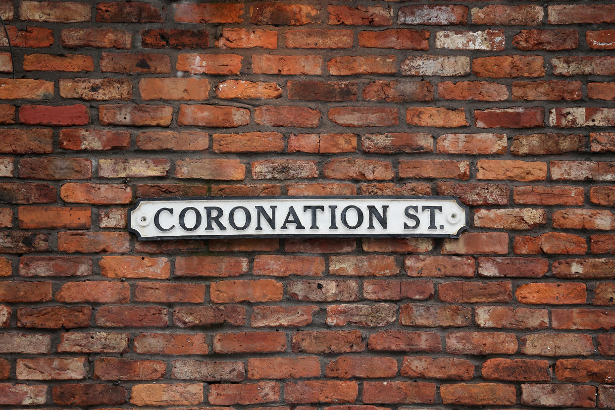 MANCHESTER, ENGLAND - NOVEMBER 21:  The famous Coronation St soap opera street sign hangs on the wall of the Rovers Return on November 21, 2014 in Manchester, England. Christmas on the street has been celebrated for 53 years since the first ever episode was screened. Visitors to the former Granada TV studios can now sample the festive atmosphere during their tour as the sets are decorated as they would be in the soap opera. The former studios at Granada Television have been turned into a visitor attraction since production of Coronation St moved to modern facilities in Salford. The attractions Christmas theme will be open between Novemeber 22nd and January 11th 2015.  (Photo by Christopher Furlong/Getty Images)