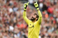 Liverpool's Brazilian goalkeeper Alisson Becker celebrates