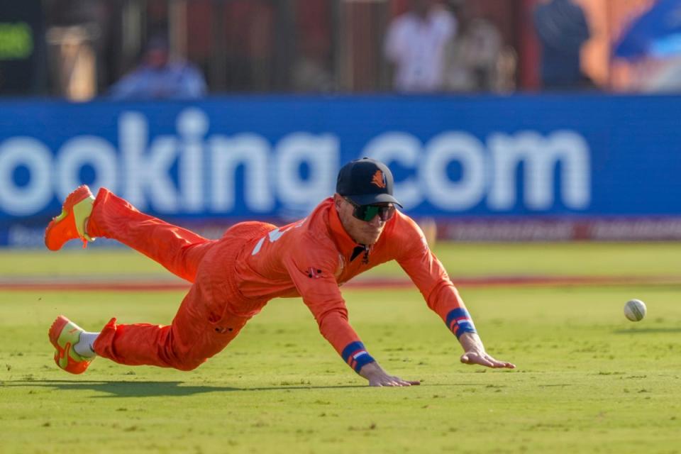 Netherlands’ Sybrand Engelbrecht dives to field a ball during the ICC Men’s Cricket World Cup match between Pakistan and Netherlands in Hyderabad (AP)