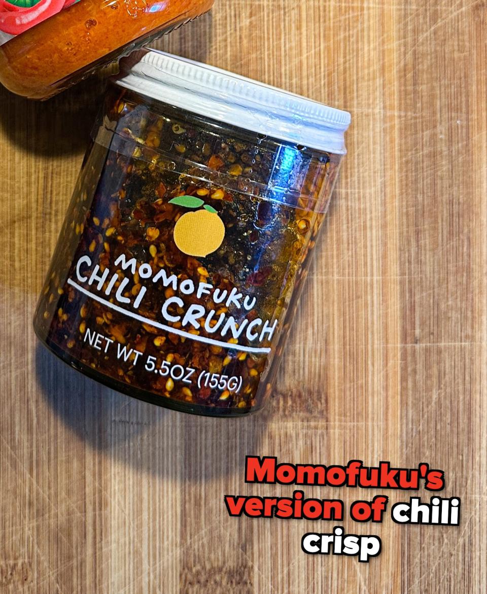 Chili crunch sauce on a wooden surface