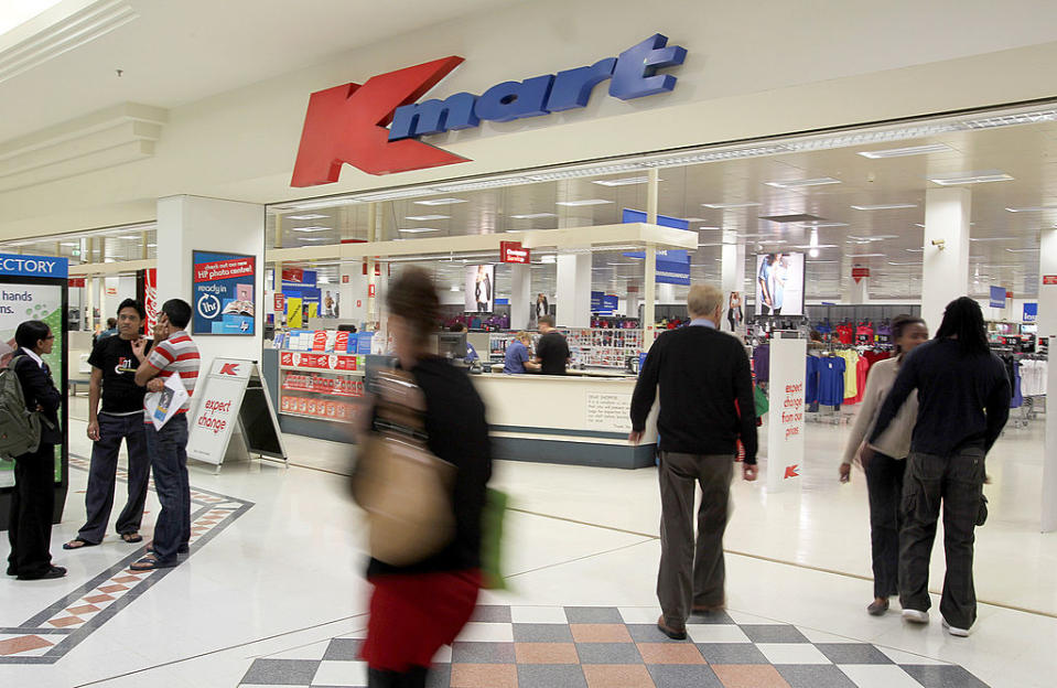 Shoppers in front of a Kmart Australia store front.