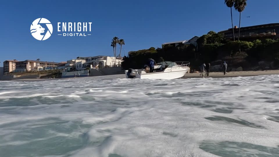 A screengrab from a video shows people exiting a boat at Windansea Beach in La Jolla, California. - Courtesy Enright Digital