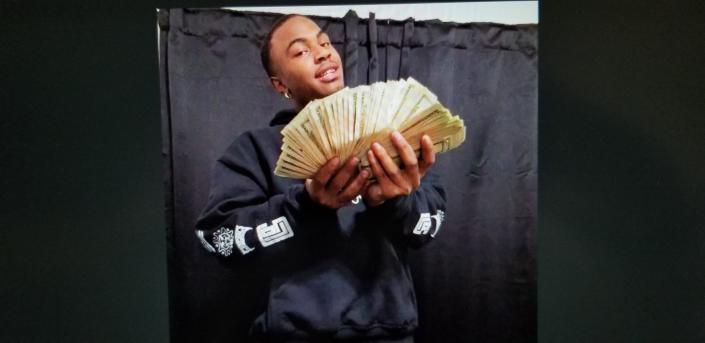 Drug dealer Cameron Jermaine Payne flashes money in a social media post that became evidence against him in a murder case.