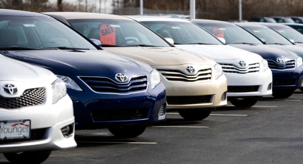 Toyota vehicles on a dealership lot.