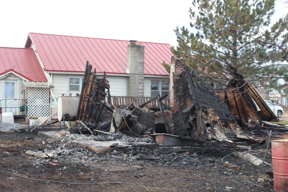 Little more than the charred remains of a washer, dryer and bathtub can be identified in this structured burned in the West Wind Fire.