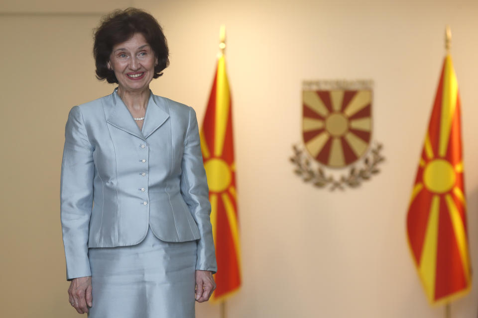 Gordana Siljanovska Davkova, the new President of North Macedonia poses for the cameras at the entrance of the presidential palace in Skopje, North Macedonia, on Sunday, May 12, 2024. Siljanovska Davkova was sworn as first female president in North Macedonia on Sunday after her triumph in a presidential runoff earlier this week over the leftist incumbent president. (AP Photo/Boris Grdanoski)