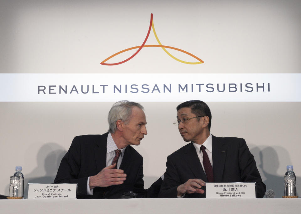 FILE - In this March 12, 2019, photo, Renault Chairman Jean-Dominique Senard, left, and Nissan CEO Hiroto Saikawa speak at the start of a joint press conference following a board meeting at the Nissan headquarters in Yokohama, near Tokyo. Japanese automaker Nissan wasn’t consulted about a proposed merger between its French alliance partner Renault and Fiat Chrysler and has little say over the issue. Partnering with a colossal Renault-Fiat Chrysler could help Nissan slash costs on shared components and research. (AP Photo/Eugene Hoshiko, File)