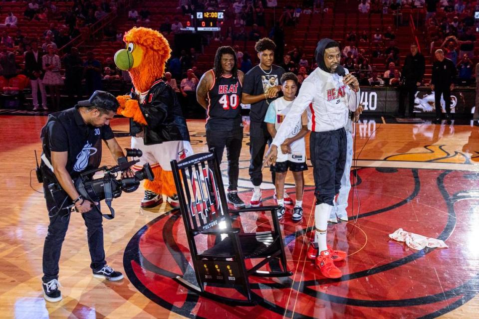 Miami Heat forward Udonis Haslem points to his rocking chair for his retirement before playing his last regular season game with the organization during an NBA game against the Orlando Magic at Kaseya Center in Downtown Miami, Florida, on Sunday, April 9, 2023.