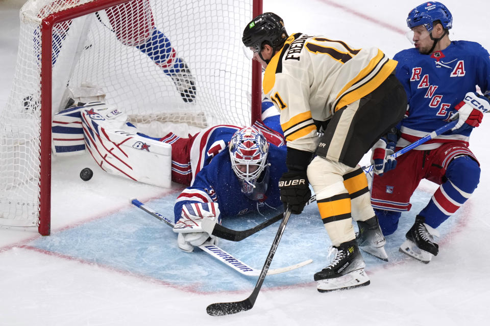 New York Rangers goaltender Igor Shesterkin (31) drops to the ice on a goal by Boston Bruins center Trent Frederic (11) during the second period of an NHL hockey game, Saturday, Dec. 16, 2023, in Boston. (AP Photo/Charles Krupa)