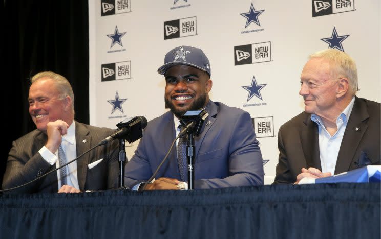 Cowboys director of player personnel Stephen Jones, left, and owner Jerry Jones, right, with Ezekiel Elliott after he was drafted. (AP)