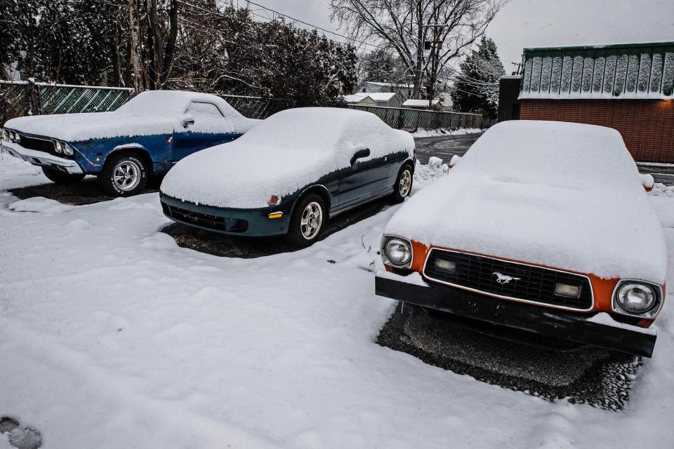 Cars sit covered in snow near Buckley Mill Road after a snowstorm dropped close to 3 inches since yesterday in Wilmington, Tuesday, Jan. 16, 2023.
