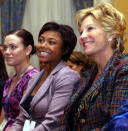 FILE - Five-time Olympic medal-winning and world record-holding swimmer Natalie Coughlin, left, three-time Olympic medal-winning gymnast Dominique Dawes, center, and two-time Olympic gold medal-winning swimmer Donna de Varona listen to speakers during a news conference sponsored by the Women's Sports Foundation Monday, Oct. 18, 2004, in New York. “We're at a time where Title IX is going to be exploited and celebrated,” said Donna de Varona, the Olympic gold-medal swimmer who heads the Women's Sports Policy Working Group. (AP Photo/Kathy Willens, File)