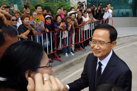Former Thai prime minister Somchai Wongsawat greets supporters as he arrives at the Supreme Court in Bangkok, Thailand, August 2, 2017. REUTERS/Aukkarapon Niyomyat