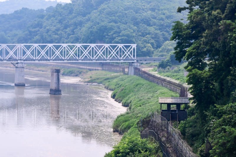 A U.S. soldier moved into North Korea after leaving part of a tour to the Joint Security Area in the Demilitarized Zone shared by North and South Korea. Photo by Thomas Maresca/UPI