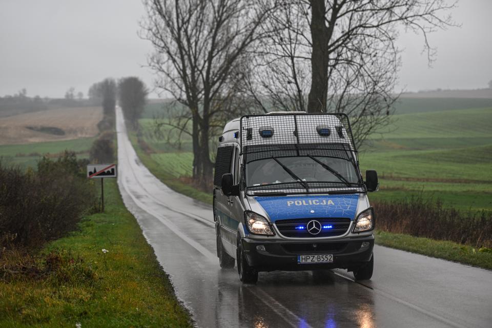 A police van patrols side roads next to the missile explosion site (Getty Images)