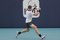 Mar 24, 2019; Miami Gardens, FL, USA; Kyle Edmund of Great Britain hits a backhand against Milos Raonic of Canada (not pictured) in the third round of the Miami Open at Miami Open Tennis Complex. Mandatory Credit: Geoff Burke-USA TODAY Sports