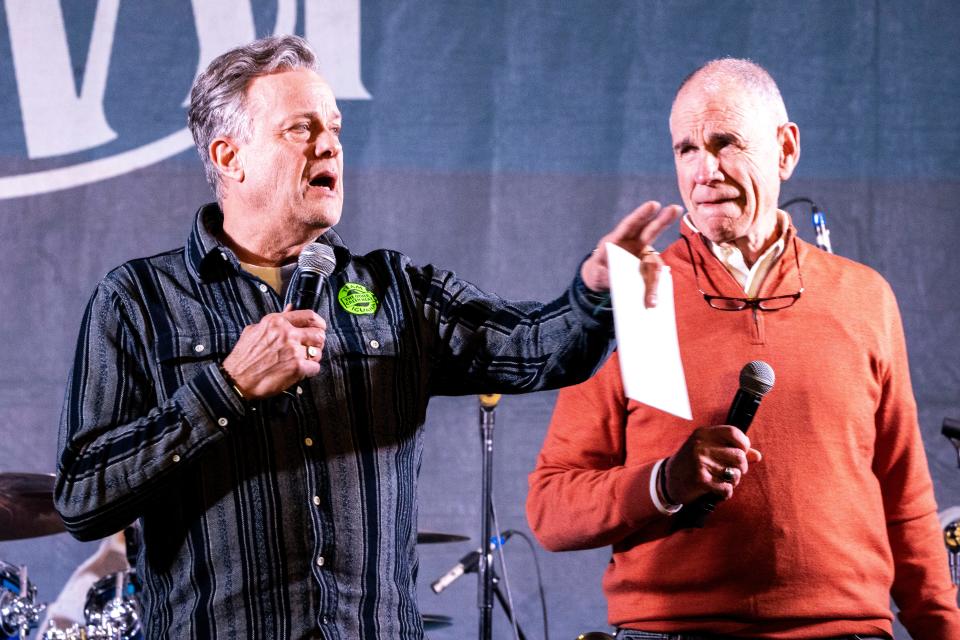 Former KCCI newscaster Steve Karlin and Des Moines City Council member Carl Voss introduce the auction of late RAGBRAI co-founder Donald Kaul's refurbished bike during the RAGBRAI 2024 route announcement party on Saturday, Jan. 27, 2024, in Des Moines.