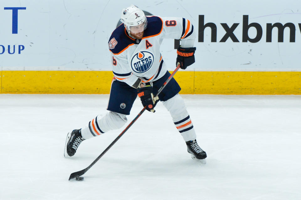 Jan 2, 2019; Glendale, AZ, USA; Edmonton Oilers defenseman Adam Larsson (6) shoots during the second period against the Arizona Coyotes at Gila River Arena. Mandatory Credit: Matt Kartozian-USA TODAY Sports