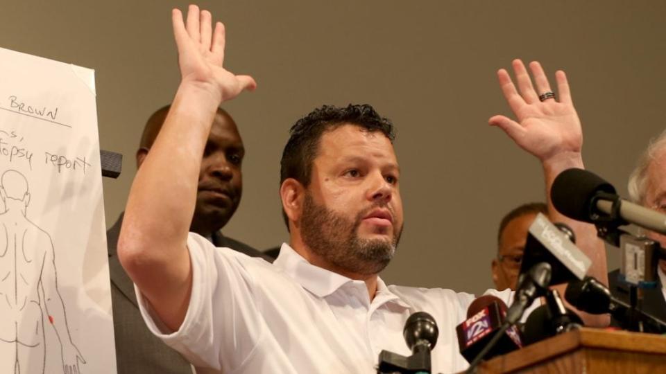 Shawn Parcells, who assisted in the autopsy of Michael Brown, speaks about his findings at an August 2014 press conference at the Greater St. Marks Family Church in Ferguson, Missouri, held nine days after the unarmed teenager was shot and killed by a police officer there. (Photo by Joe Raedle/Getty Images)