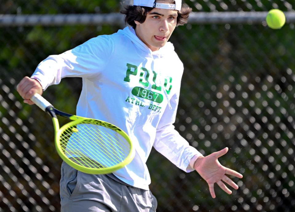 OSTERVILLE   5/17/23    Cape Cod Academy number three singles player Ayden Naydenov returns a shot at his Sturgis opponent.