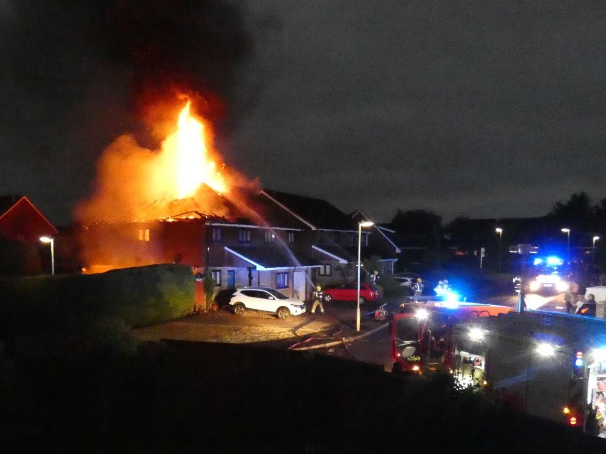 Firefighters tackle a blaze after lightning struck two semi-detached houses in Andover, Hampshire, on Saturday morning (PA)