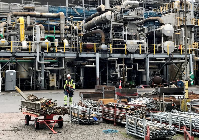 FILE PHOTO: A worker walks at the Yara ammonia plant in Porsgrunn