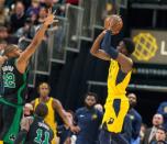 Nov 3, 2018; Indianapolis, IN, USA; Indiana Pacers guard Victor Oladipo (4) shoots the game winning three point basket over Boston Celtics center Al Horford (42) in the second half at Bankers Life Fieldhouse. Trevor Ruszkowski-USA TODAY Sports