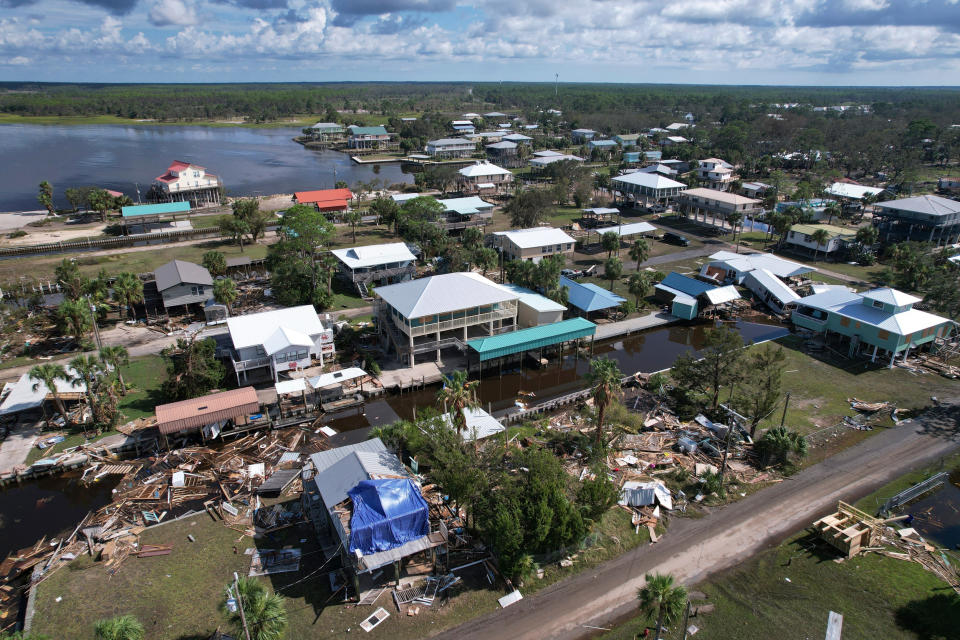 Debris from homes swept off their lots is scattered amid homes on stilts which survived, in Horseshoe Beach, Fla., on Aug. 31, 2023, one day after the passage of Hurricane Idalia. (Rebecca Blackwell / AP)
