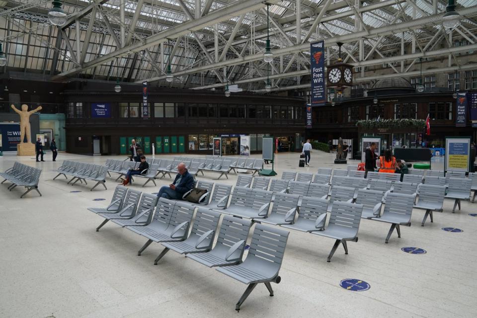 Glasgow Central Station lies almost deserted on Tuesday (Andrew Milligan/PA) (PA Wire)