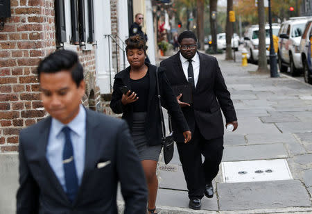 Walter Scott's son Miles Scott (R) leaves the Charleston federal court building after testifying during the 3rd day of the sentencing hearing for former North Charleston policeman Michael Slager in Charleston, South Carolina, U.S., December 6, 2017. REUTERS/Randall Hill