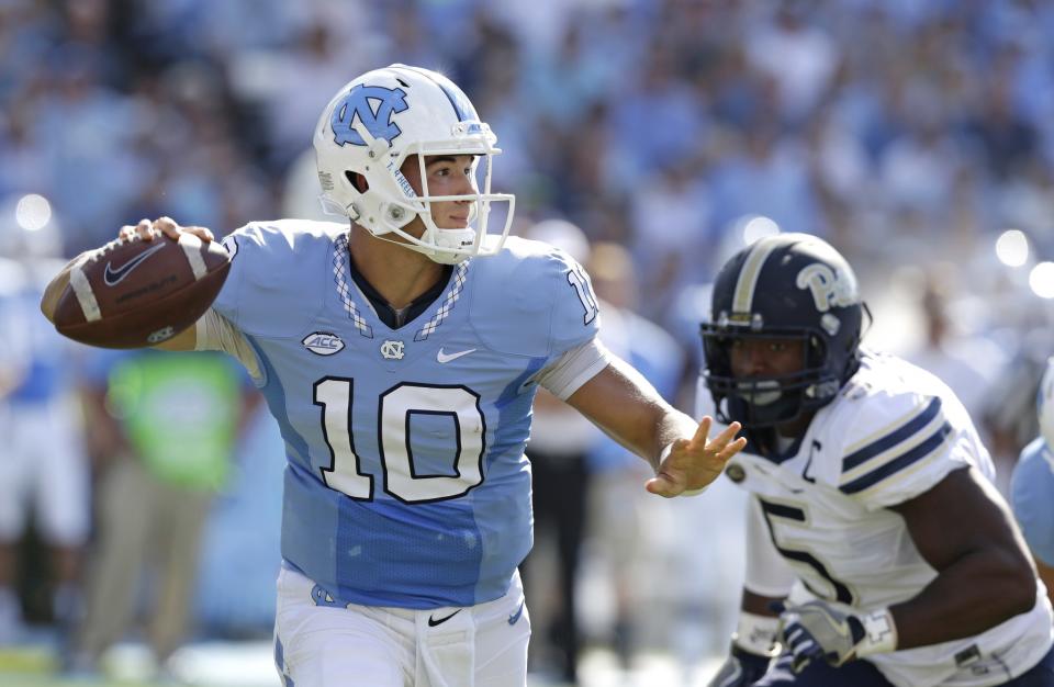 North Carolina quarterback Mitch Trubisky (10) passes as Pittsburgh's Ejuan Price (5) rushes during the first half of an NCAA college football game in Chapel Hill, N.C., Saturday, Sept. 24, 2016. (AP)