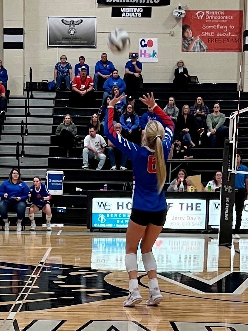 Highland's Larsen Terrill sets the ball during a Division II district championship volleyball match at Westerville Central last year.