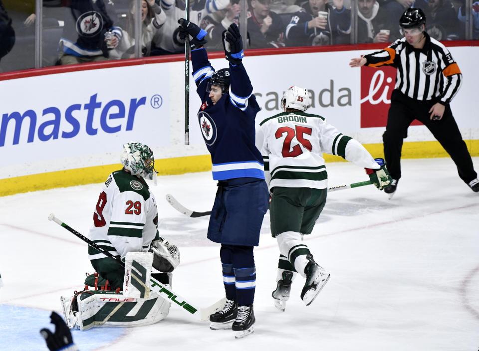 Winnipeg Jets' Gabriel Vilardi celebrates his goal against Minnesota Wild goaltender Marc-Andre Fleury (29) during the third period of an NHL hockey game Tuesday, Feb. 20, 2024, in Winnipeg, Manitoba. (Fred Greenslade/The Canadian Press via AP)