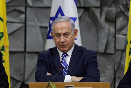 FILE PHOTO: Israeli Prime Minister Benjamin Netanyahu attends the weekly cabinet meeting, convened at the Dimona municipality building in southern Israel, March 20, 2018. REUTERS/Ronen Zvulun/File Photo