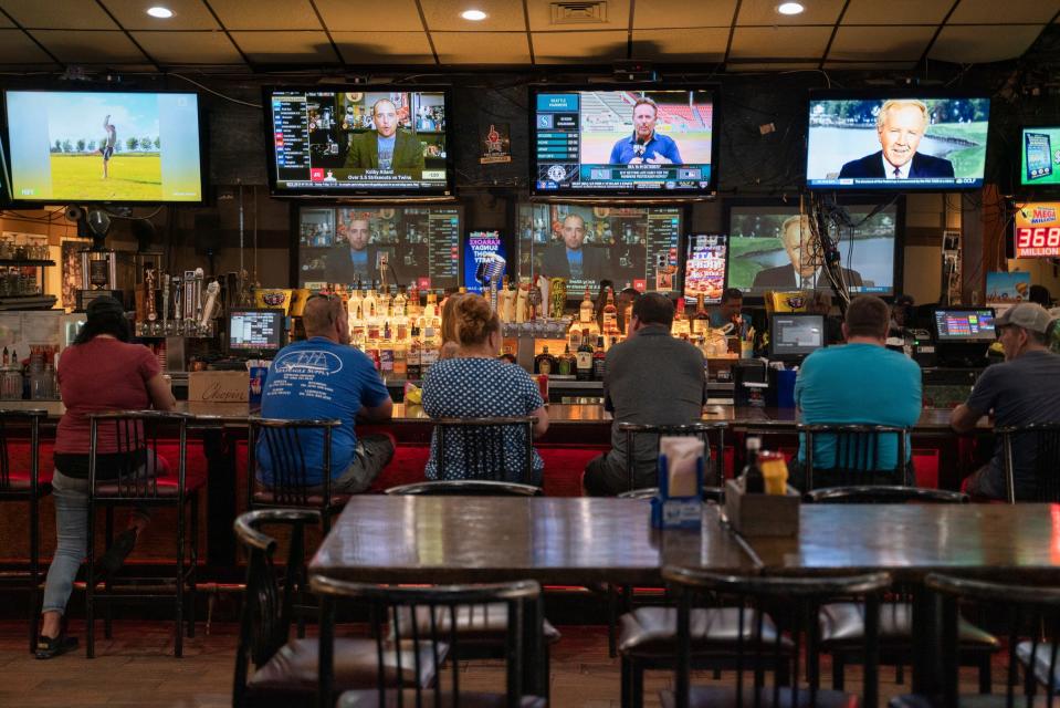 People sit at the bar inside Jamboozies Sports Bar & Grill in Sterling Heights on Wednesday, June 28, 2023. 