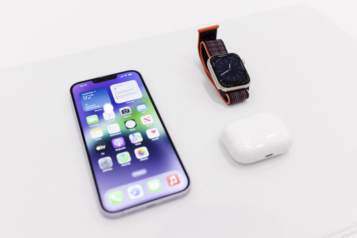 The new iPhone 14 is displayed alongside the new Apple Watch 8 Series and new AirPod Pros during a launch event for new products at Apple Park in Cupertino, California, on September 7, 2022. - Apple unveiled several new products including a new iPhone 14 and 14 Pro, three Apple watches, and new AirPod Pros during the event. (Photo by Brittany Hosea-Small / AFP) (Photo by BRITTANY HOSEA-SMALL/AFP via Getty Images)