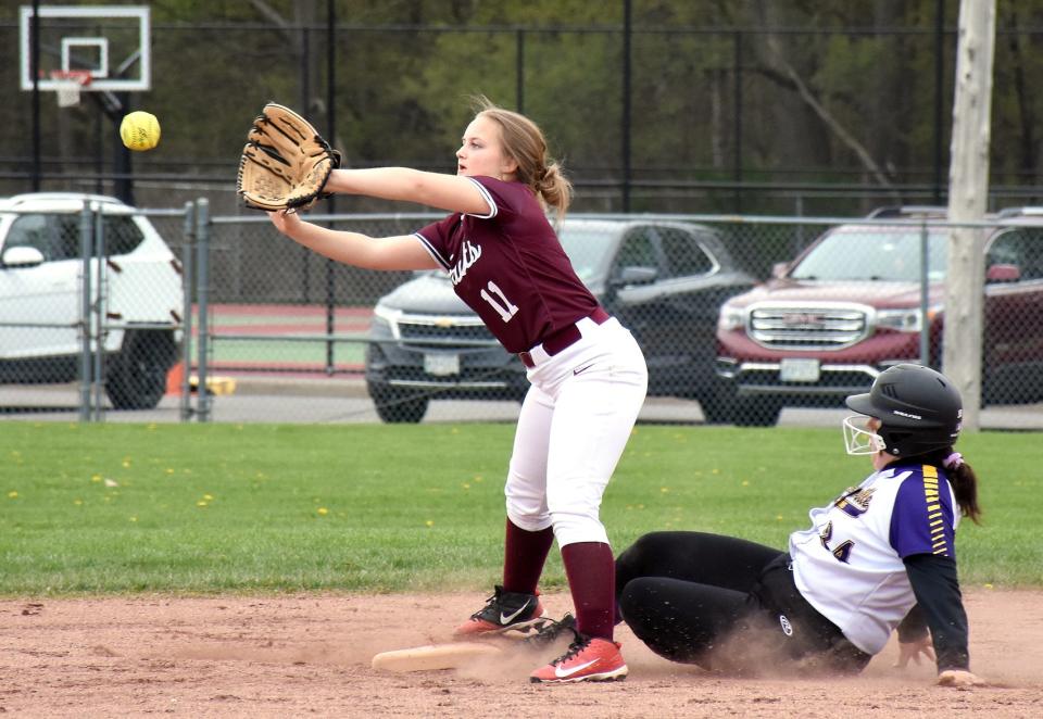 Frankfort-Schuyler second baseman Sophia Hazeltine reaches for a throw as Waterville Indian Gracie Beach (right) slides in safely during the first game Friday.