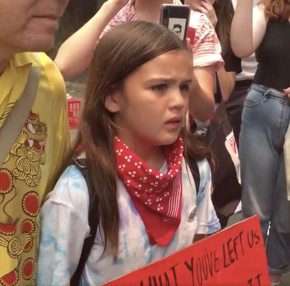 13-year-old Izzy Raj-Seppings sobs as police issue move-on notice at climate change protest in Sydney.