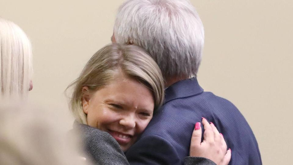 Jim Krauseneck's daughter Sara gives her father a hug in court. / Credit: Shawn Dowd/Pool