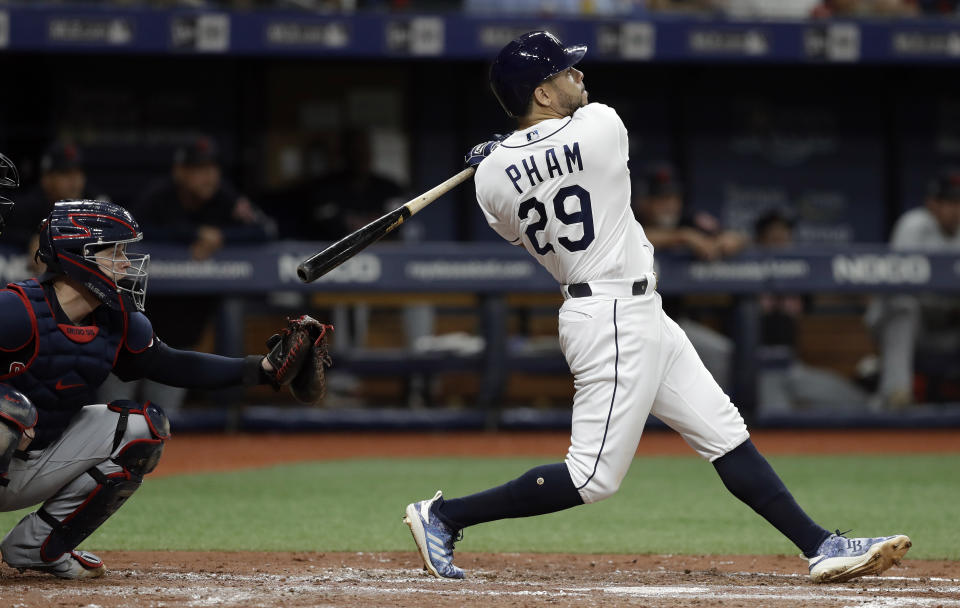 FILE - In this Aug. 31, 2019, file photo, Tampa Bay Rays' Tommy Pham (29) watches his two-run home run off Cleveland Indians starting pitcher Zach Plesac during the third inning of a baseball game in St. Petersburg, Fla. The San Diego Padres have acquired Pham and infielder-pitcher Jake Cronenworth from the Rays for outfielder Hunter Renfroe, minor league infielder Xavier Edwards and a player to be named. (AP Photo/Chris O'Meara, File)