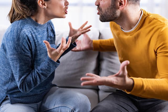 <p>skynesher/Getty</p> Stock photo of a couple fighting