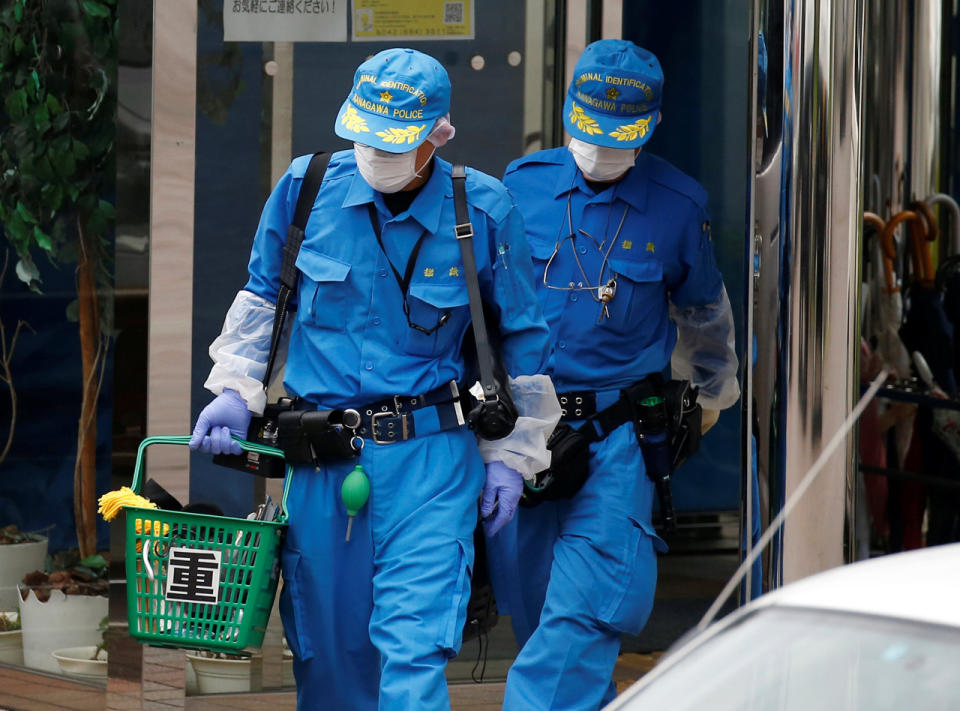 <p>Police officers investigate at a facility for the disabled, where a deadly attack by a knife-wielding man took place, in Sagamihara, Kanagawa prefecture, Japan, July 26, 2016. (REUTERS/Issei Kato)</p>