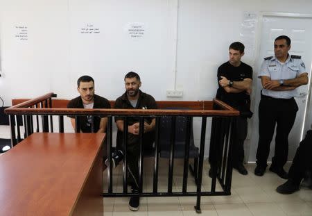 Palestinian men, one of them is Mohammed Bargess, (2nd L) attend a hearing in a military courtroom at Israel's Ofer Prison near the West Bank city of Ramallah October 1, 2017. Picture taken October 1, 2017. REUTERS/Ammar Awad