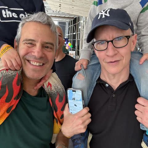 <p>Instagram/andersoncooper</p> Andy Cohen (left) and Anderson Cooper holding their sons